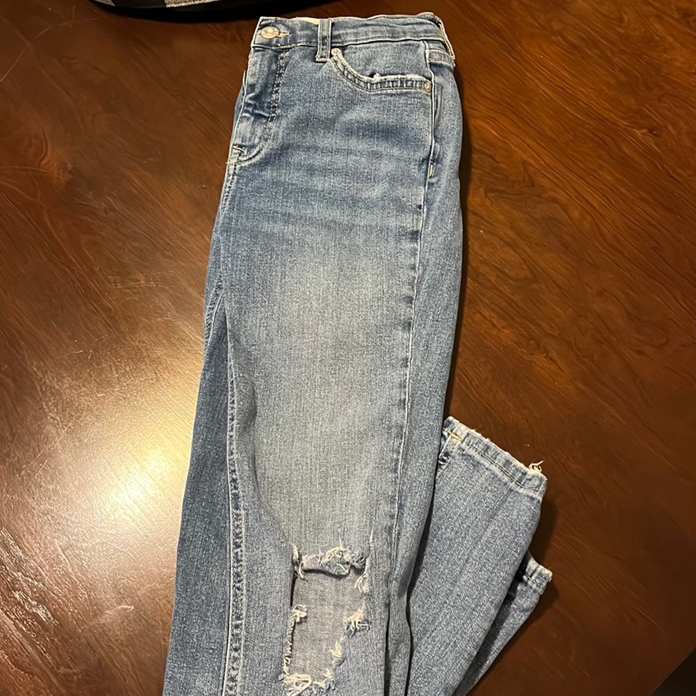 Size 26 Free People ripped knee skinny jeans